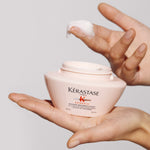 kerastase genesis masque reconstituant hair mask product in hand